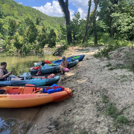 kayaks on river's edge